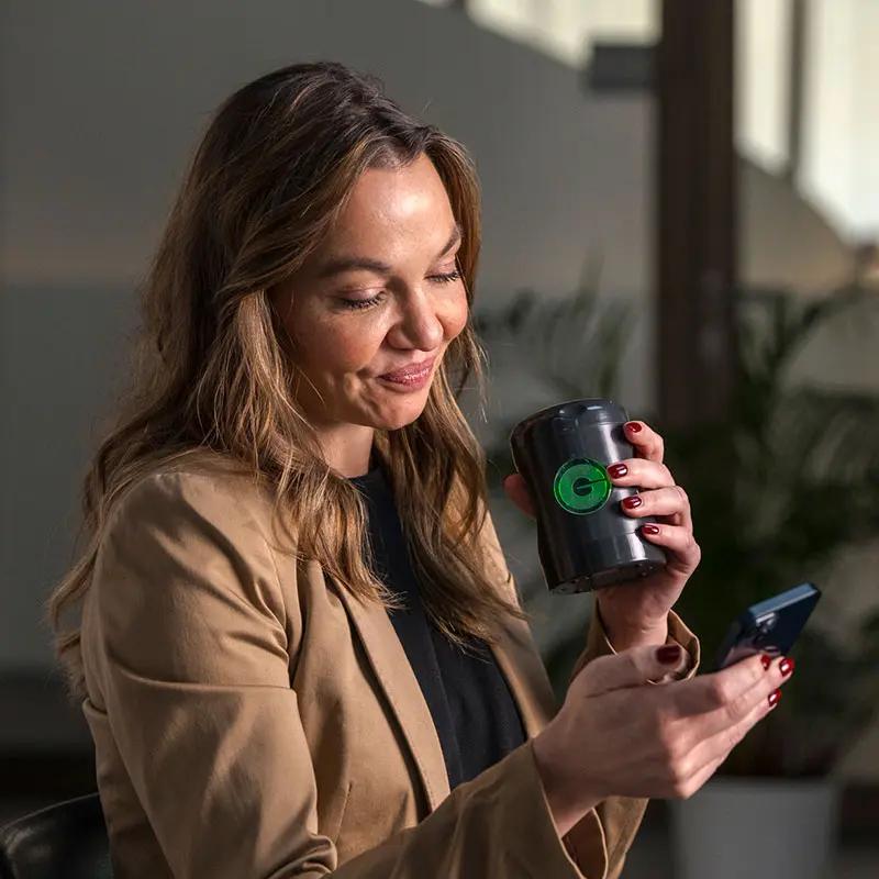 Woman using the app for the Myromi device