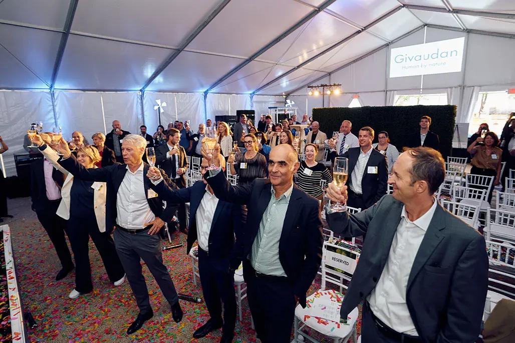 A champagne toast with the EC, officials and Givaudan employees