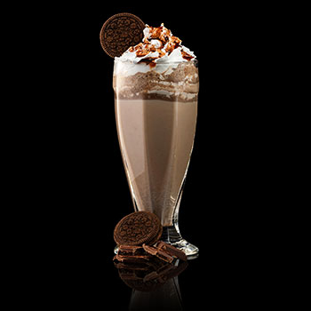Chocolate milkshake with an oreo cookie and sauce Chocolate milkshake with an oreo cookie and sauce