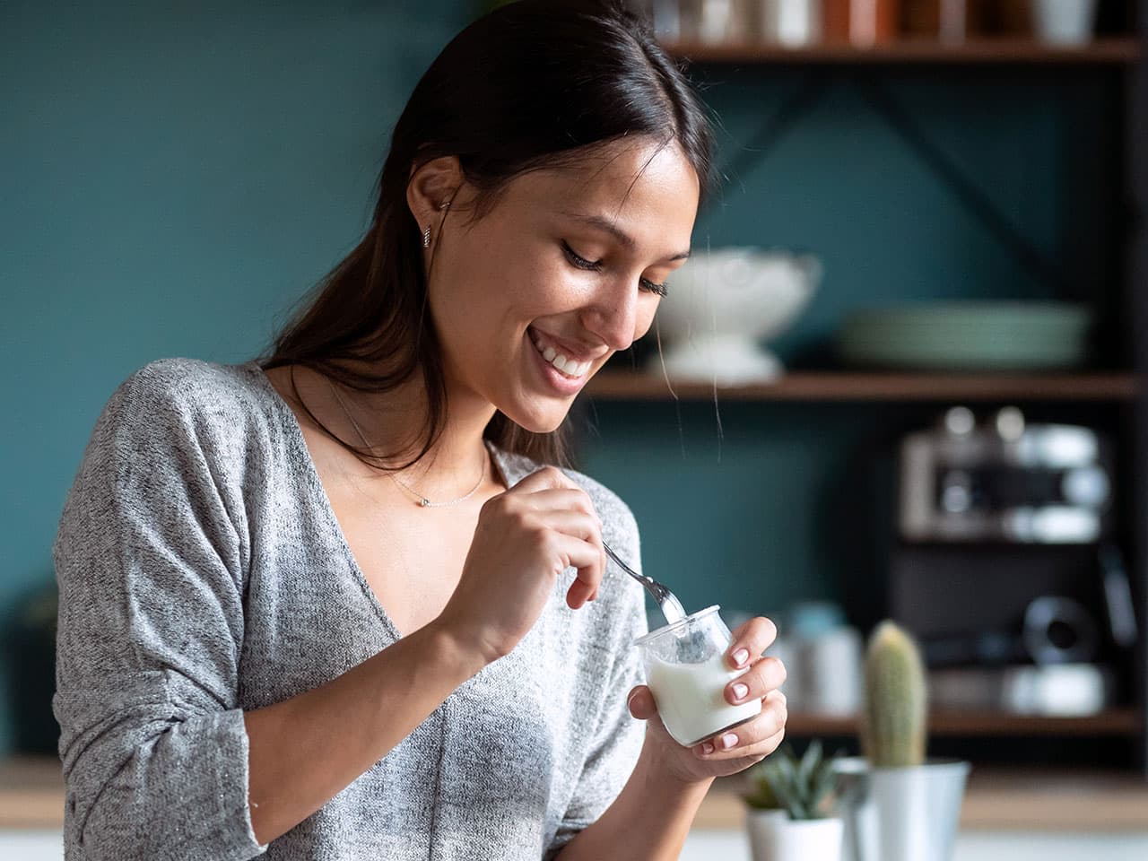 Woman eating yoghurt